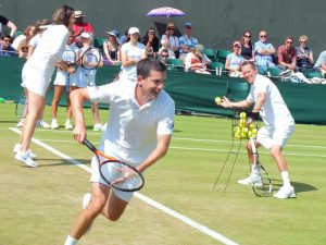 "Come on Tim!"... Tim Henman and Lindsay Davenport rally with the kids on Day 6 of Wimbledon